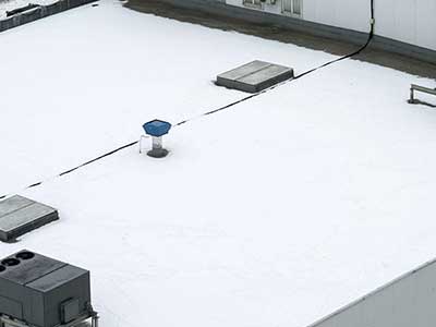 Top view of a generic flat, white commercial roof
